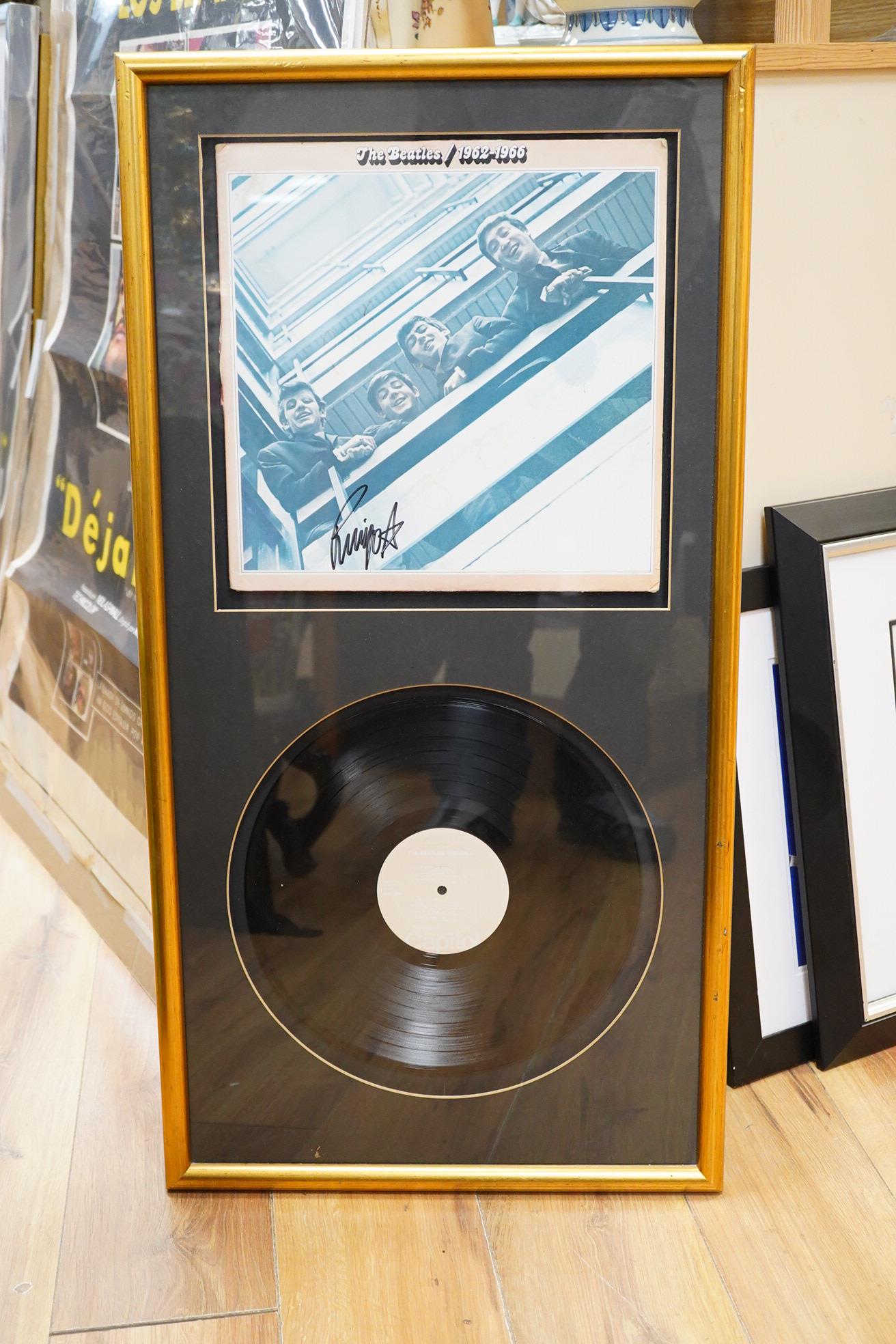 Three framed Beatles autographs; a framed signed album (missing Lennon), 84 x 44cm overall a photograph of Paul McCartney and a photograph of Ringo Starr, both signed across the image